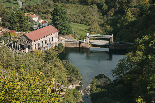 Small hydroelectric plant in a green valley