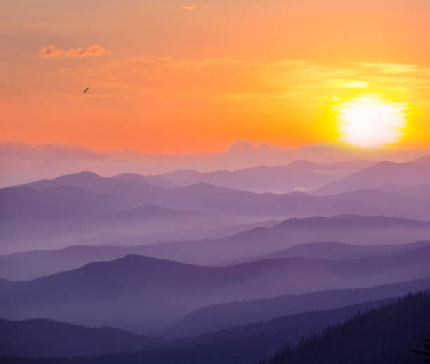 istock mountain chain silhouette in dense mist and clouds at the sunset 1438913456