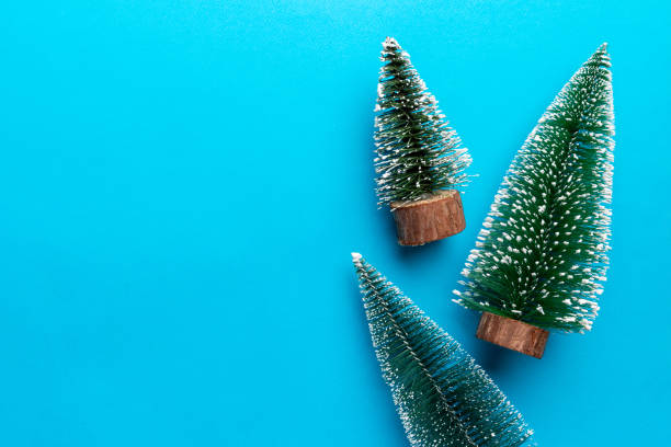istock Flat lay composition with christmas trees on color background. Top view with copy space 1438915784