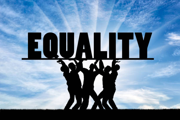 Group of people hold the word equality over them. The concept of equality in society