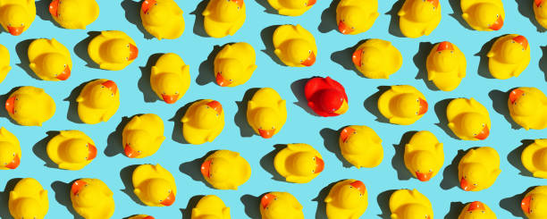 istock One out unique rubber duck concept on a blue background 1438915922