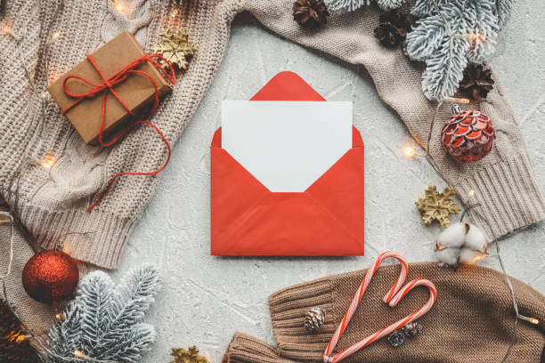 istock Red New Year's envelope with a letter top view, space for your text 1438917738