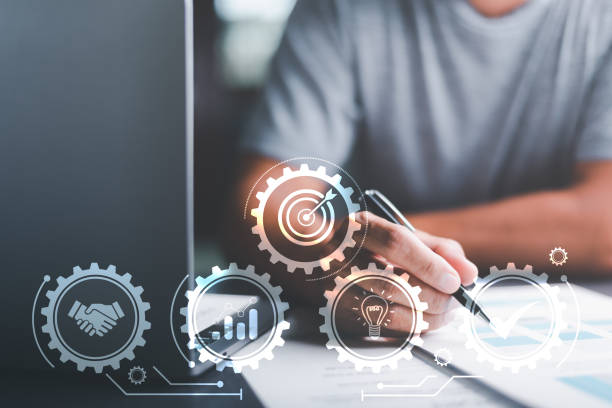istock business man handling documents and develop the company's strategy with intention, success and business target concept, planning analysis business competition, market growth opportunities 1438923797