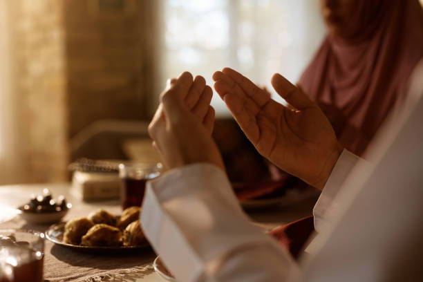 istock Close up of Middle Eastern man at dining table. 1438923864