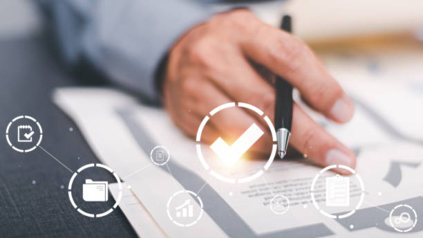 istock Businessmen review procedures through documents containing checkbox lists, rules of conduct concepts, rules and policies, company regulatory documents, terms and conditions. 1438925546