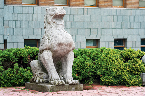 Sofia, Bulgaria, March 30, 2023; Statue of a lion near the Judicial Chamber in the city of Sofia