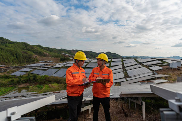 istock Two power engineers discussing at solar power plant 1438928123