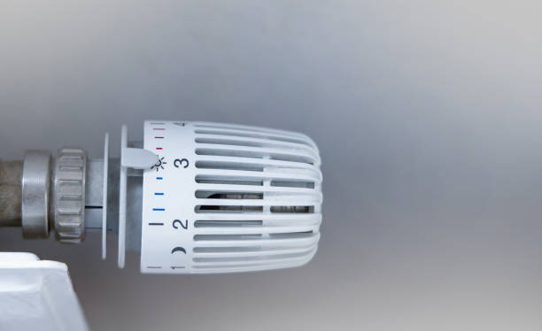 istock Heating battery temperature regulation in house with thermostat on white radiator. 1438931842