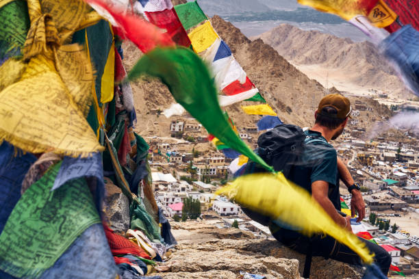 Hiker on the Peak of Victory near Namgyal Tsemo gompa (monastery) in Leh, Ladakh, India stock photo