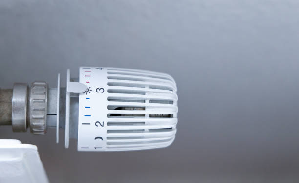 istock Heating battery temperature regulation in house with thermostat on white radiator. 1438932016