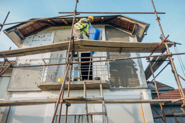 istock A construction worker builds the facade of a building 1438932119