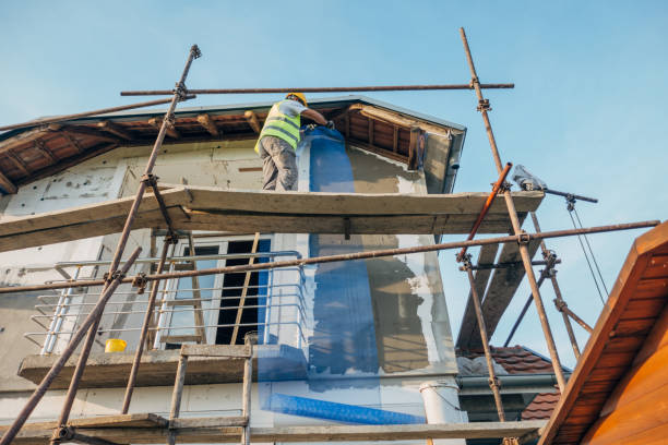 istock A construction worker builds the facade of a building 1438932134