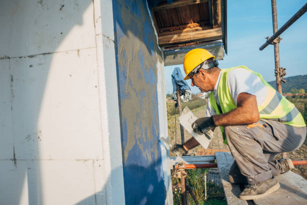 istock A construction worker builds the facade of a building 1438932159