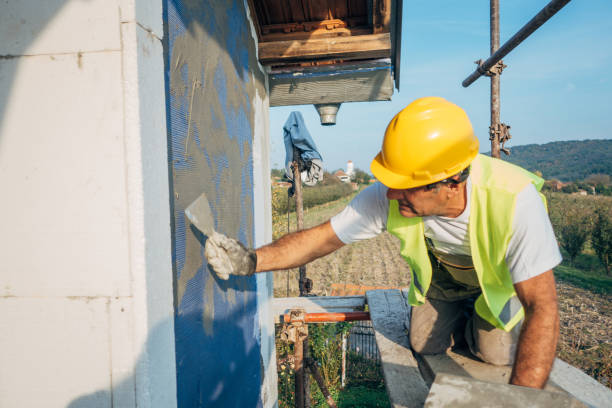 istock A construction worker builds the facade of a building 1438932175