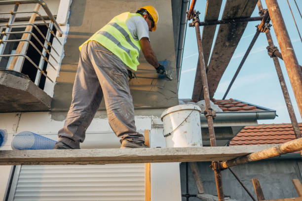 istock A construction worker builds the facade of a building 1438932232