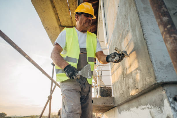 istock A construction worker builds the facade of a building 1438932253