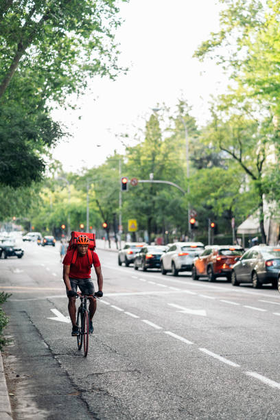 istock African Delivery Man Riding Bike 1438932373