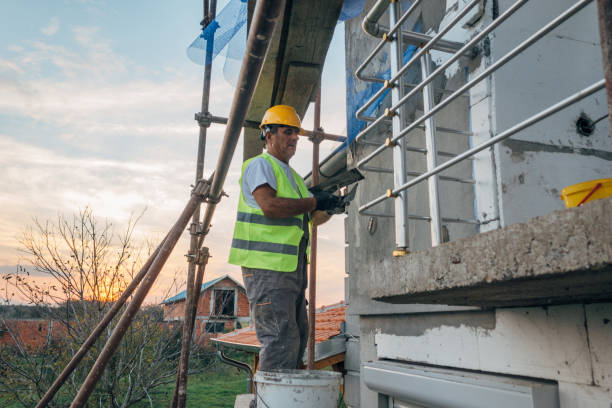 istock A construction worker builds the facade of a building 1438932428