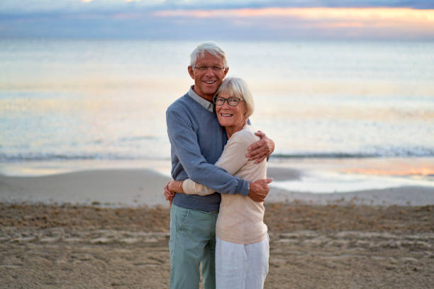 istock Senior couple on the beach 1438937407
