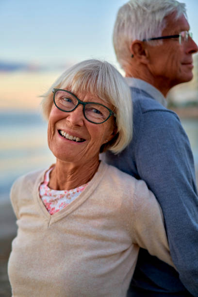 istock Senior couple on the beach 1438937423