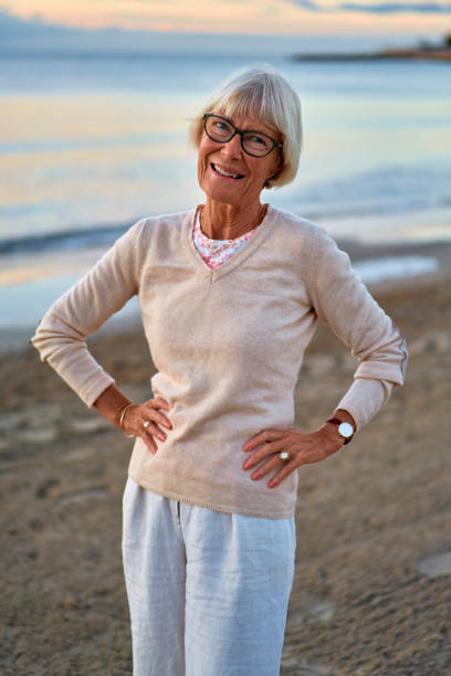 istock Senior couple on the beach 1438937436