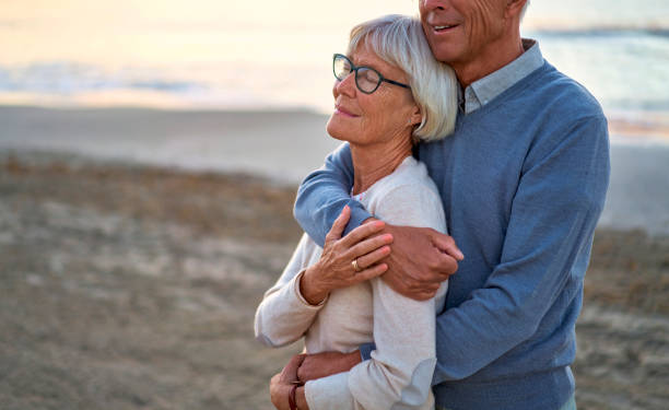 istock Senior couple on the beach 1438937460