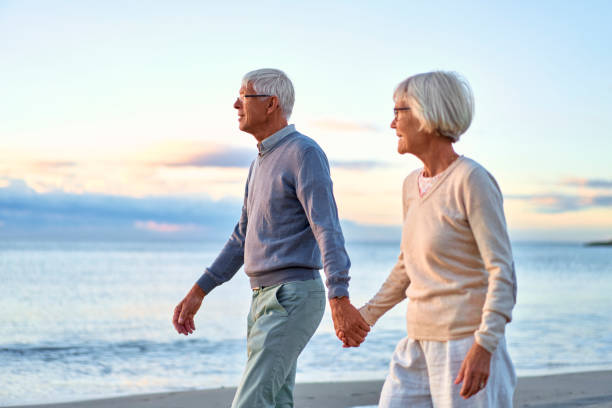istock Senior couple on the beach 1438937531