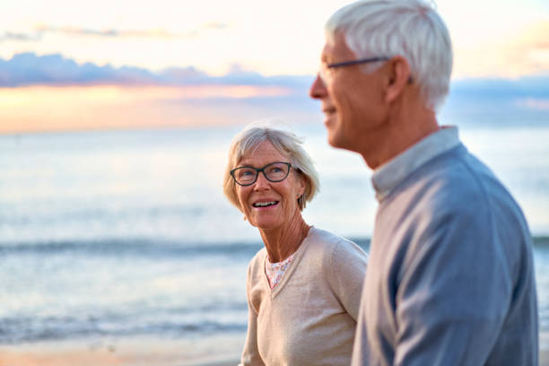 istock Senior couple on the beach 1438937542