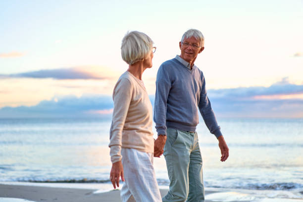 istock Senior couple on the beach 1438937559