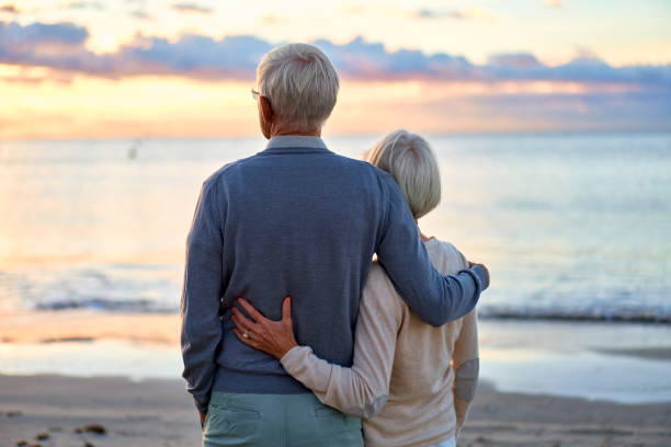 istock Senior couple on the beach 1438937561