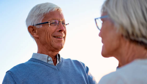 istock Senior couple on the beach 1438937672