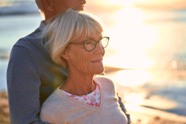 istock Senior couple on the beach 1438937735