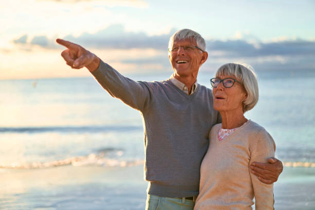 istock Senior couple on the beach 1438937759