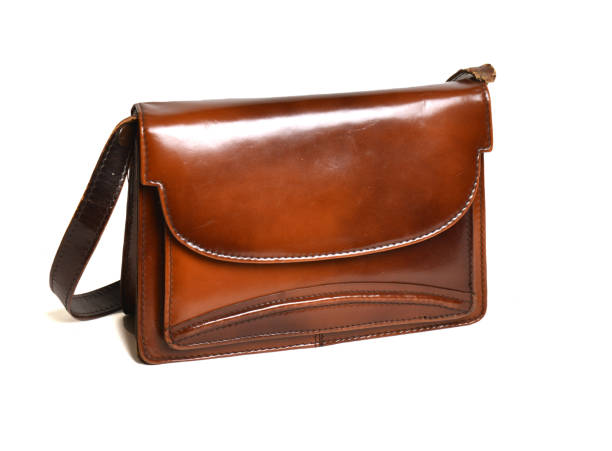 istock Closeup studio shot of a brown leather purse on white background 1438938014
