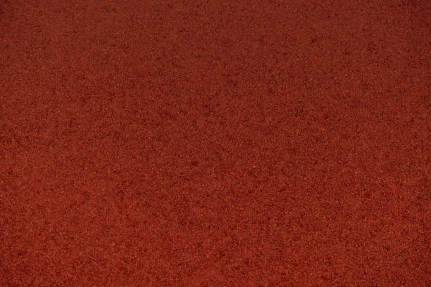 istock background red running track of stadium 1438939218