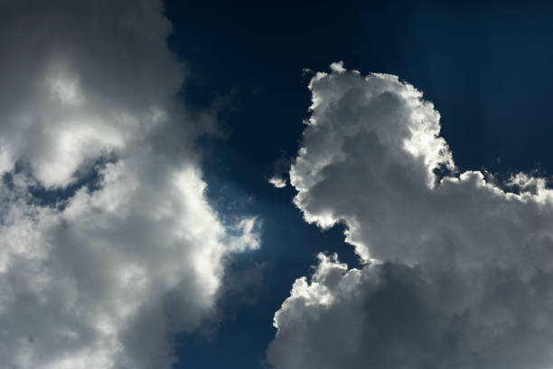 White clouds in summer. Clouds in blue sky. Weather details. Summer air.