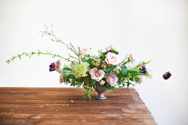 istock Bouquets of pink and violet flowers on a table 1438941862