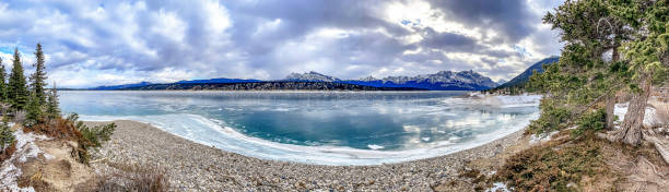 istock Panorama of a blue mountain lake 1438944413