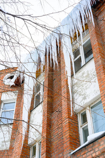 istock Close-up of icicles on the roof. 1438945817
