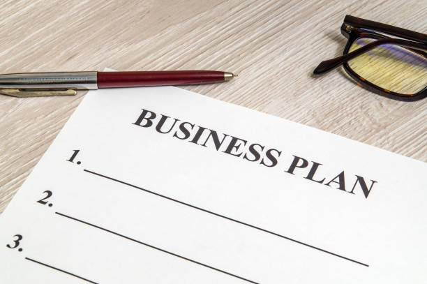 istock Blank form and pen for drawing up business plan on table 1438951342