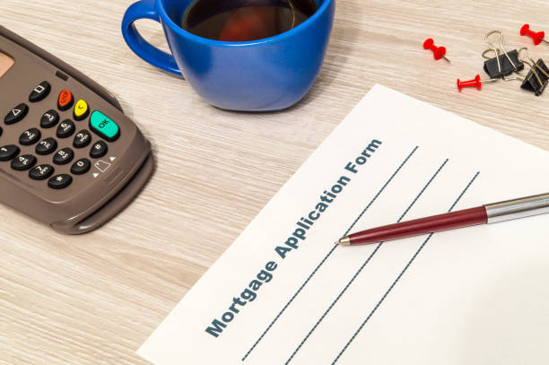 istock Mortgage agreement form blank is prepared for filling on table 1438951358