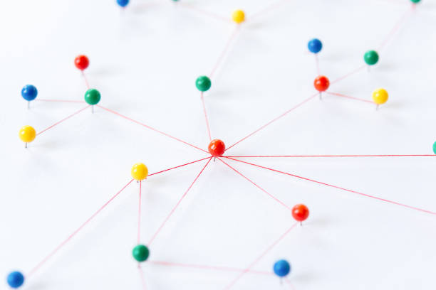 istock Linking entities, Blockchain, social media, Communications Network, The connection between the two networks. Network simulation on paper linked together by yarn 1438951404