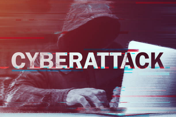 istock Cyberattack concept, hooded computer hacker working on laptop, glitch effect added in post 1438952158