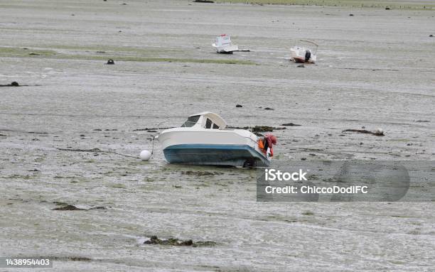 Aground Boat In The Seabed At Low Tide In The North Of France With No People Stock Photo - Download Image Now
