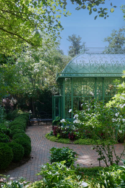 istock Vintage old greenhouse with ornate metalwork 1438955267