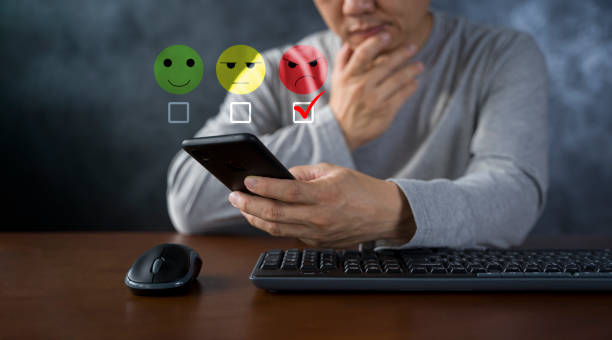 istock Man using a smartphone in give rating to service experience on application. 1438956065