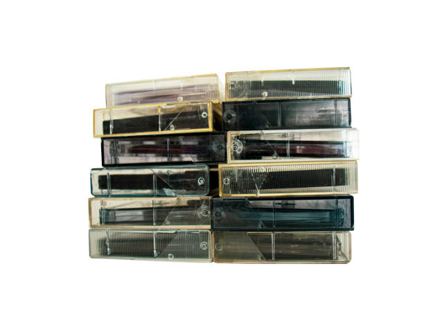 Stack of old audio cassettes on white background,audio cassette case,retro music