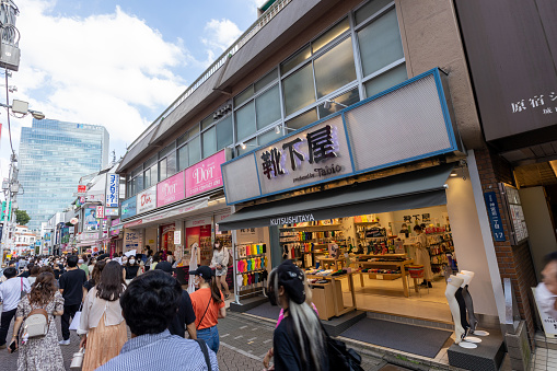 Tokyo, Japan - September 4, 2022 : People at Takeshita Street in Harajuku, Tokyo, Japan. Takeshita Street is famous tourist attraction in Tokyo. It is a pedestrian-only shopping street and popular amongst young people.