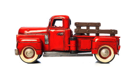 Red pick up truck toy isolated on white