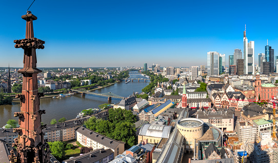 The city center of Frankfurt am Main with the skyscrapers of the banking district, the historic old town and the river Main under a cloudless sky and beautiful weather